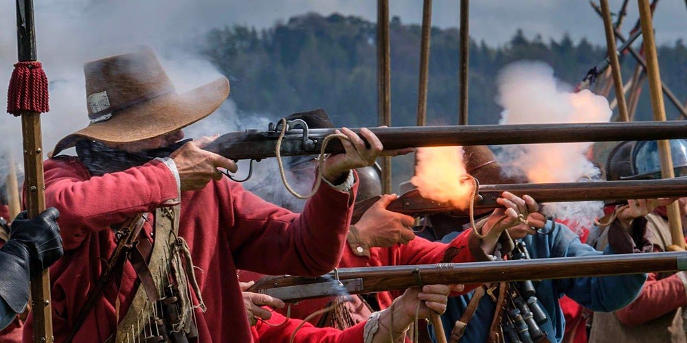 English Civil War musketeers firing at a re-enactment battle